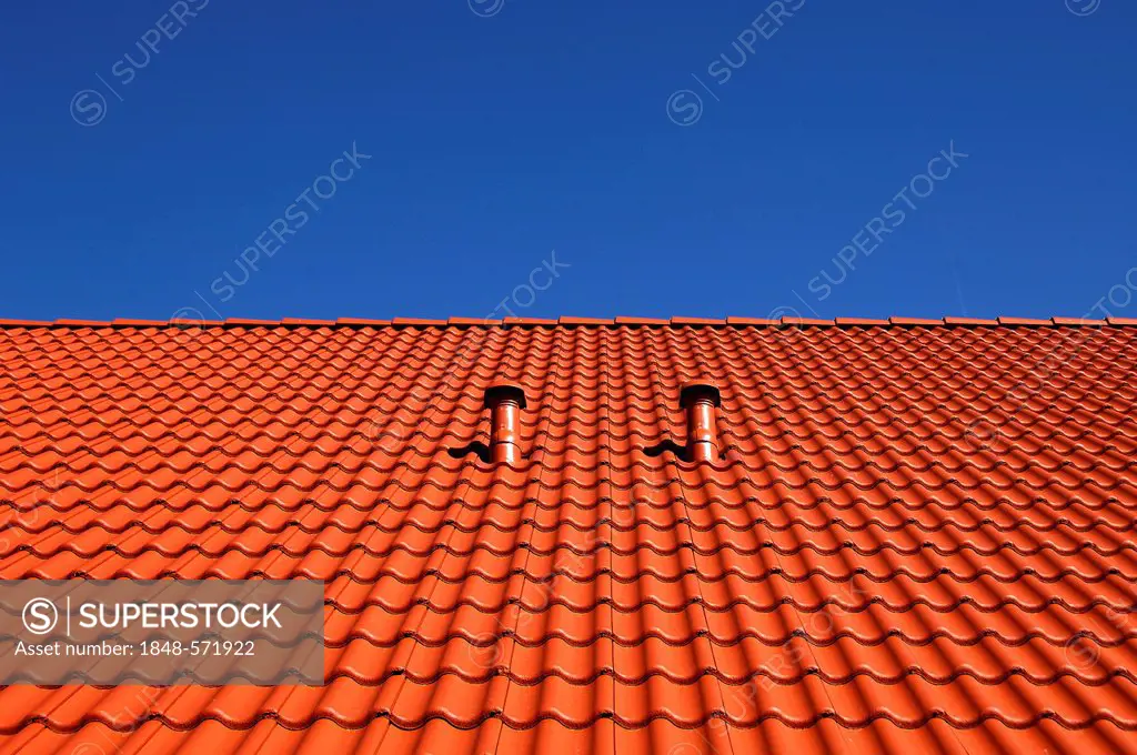 Newly covered roof with red-brown roof tiles and two ventilation pipes against a blue sky, Elbersberg, Upper Franconia, Bavaria, Germany, Europe