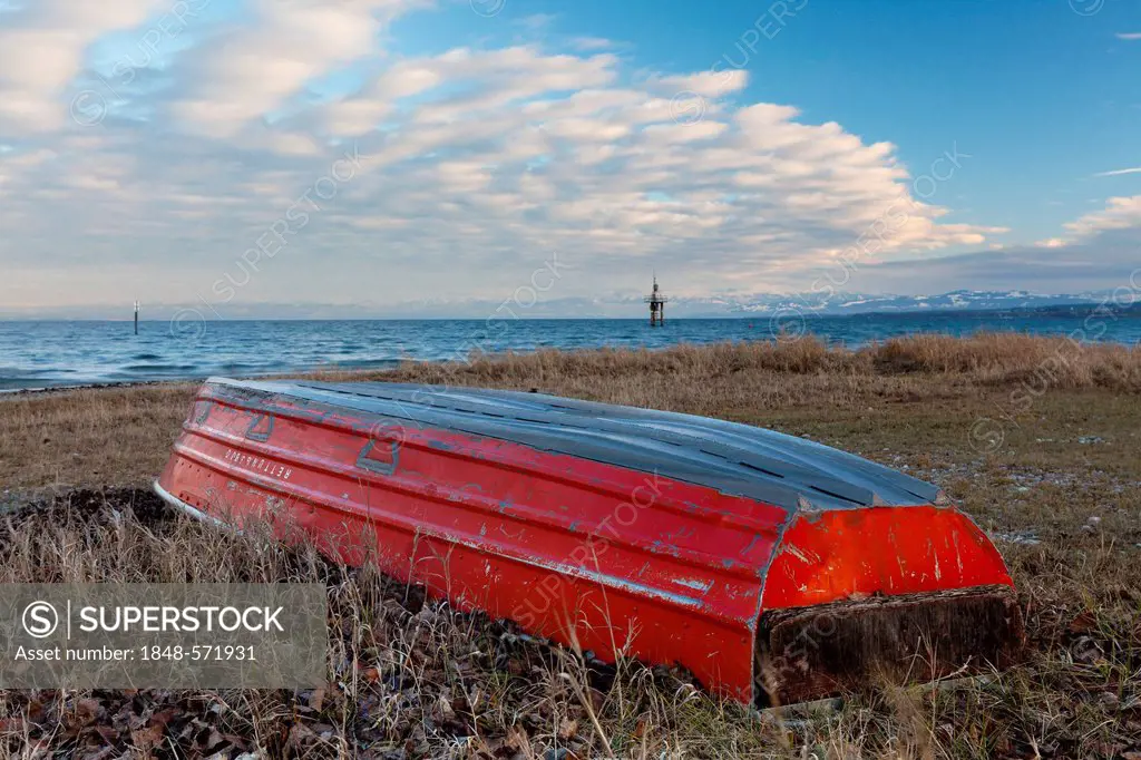 Red lifeboat lying upside down on the shore of Lake Constance near Konstanz, Constance, Baden-Wuerttemberg, Germany, Europe, PublicGround