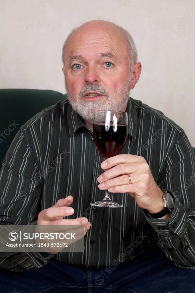 Senior man with wine glass