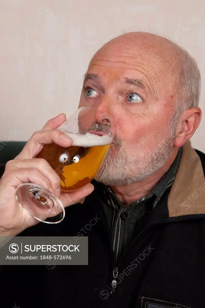 Senior man drinking beer