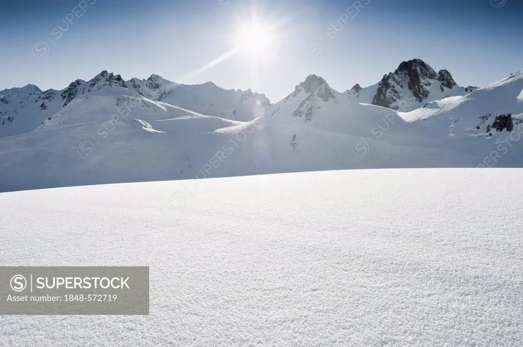 Deep snow with mountain peaks and the sun, Tignes, Val d'Isere, Savoie, Alps, France, Europe