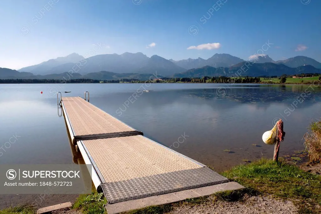 Jetty on lake Hopfensee, Allgaeu Alps at the back, Hopfen am See, Ostallgaeu, Bavaria, Germany, Europe