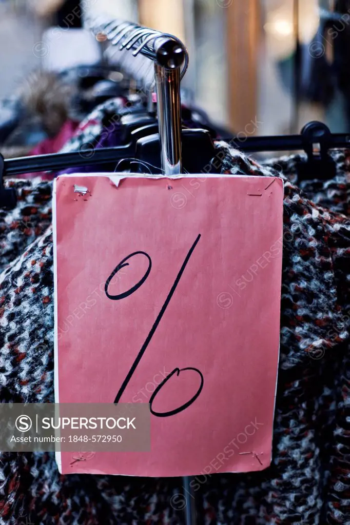Percent symbol on a clothes rack