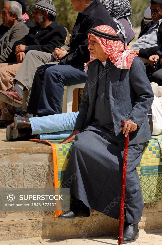 Palestinian man wearing a keffiyeh, kufiya, at a meeting listening, Temple Mount, Muslim Quarter, Old City, Jerusalem, Israel, Middle East