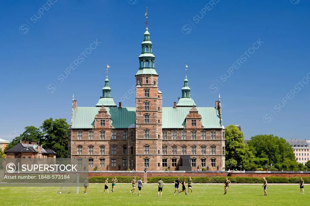 Football match on the lawn in front of Rosenborg Castle, Copenhagen, Denmark, Europe