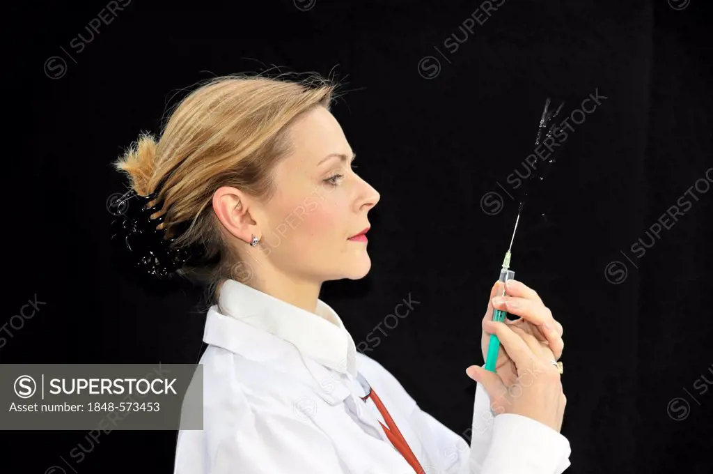 Assistant physician, young doctor preparing a syringe