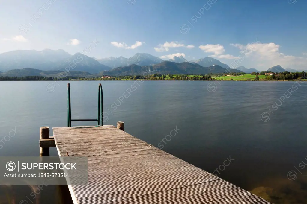 Jetty on lake Hopfensee, Allgaeu Alps at the back, Hopfen am See, Ostallgaeu, Bavaria, Germany, Europe