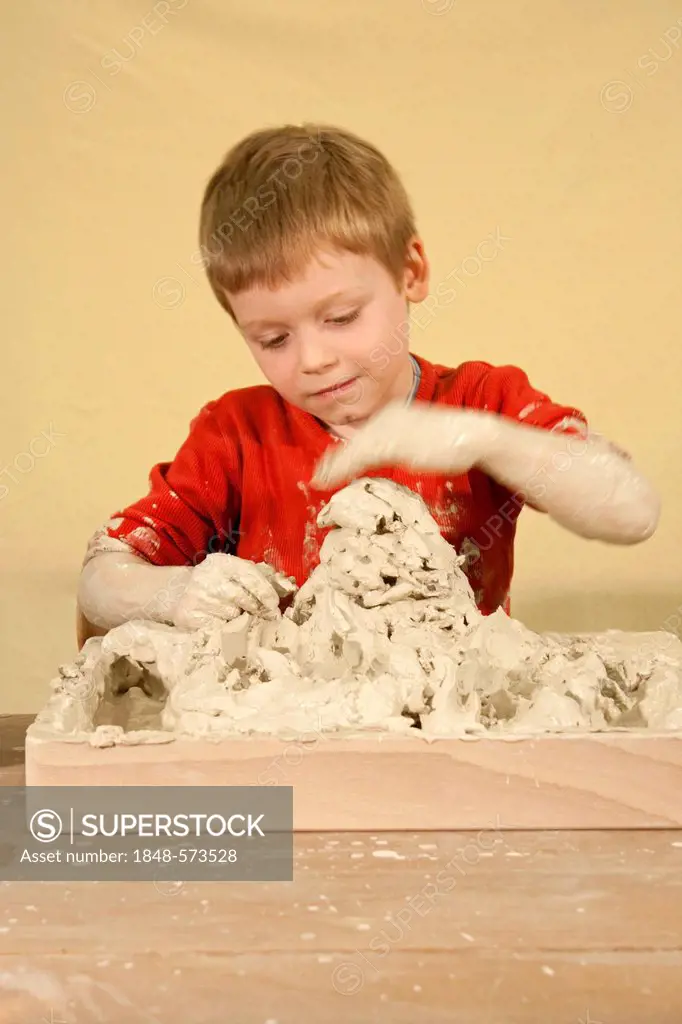 Boy doing art therapy with clay