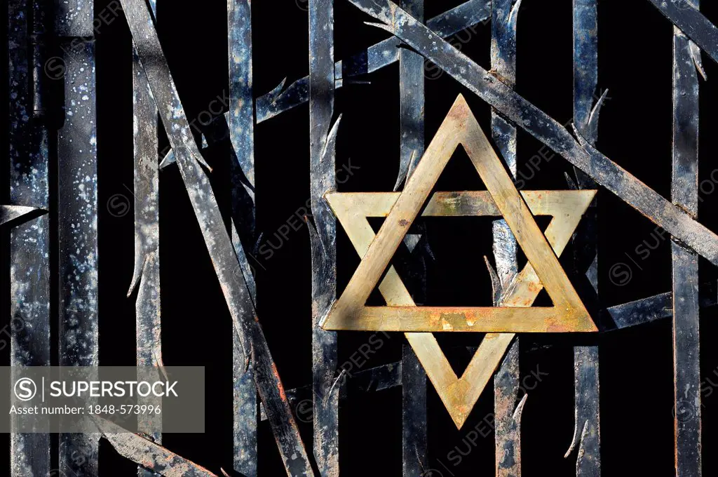 Jewish star and a barred gate at the entrance to the Jewish Memorial at Dachau Concentration Camp, Dachau, near Munich, Bavaria, Germany, Europe