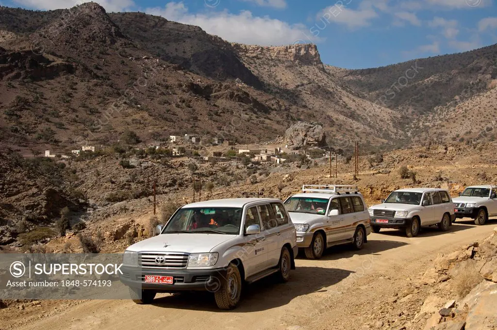 Convoy of four wheel drive vehicles with tourists on an excursion into the Jabel Shams Mountains, Sultanate of Oman, Middle East, Asia