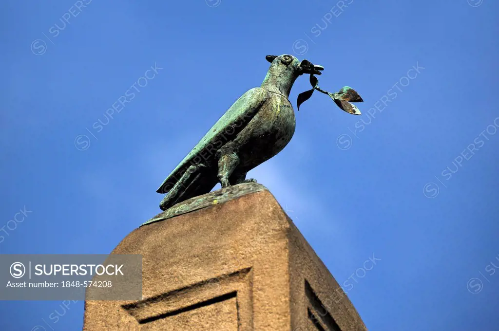 Peace dove with an olive branch on an obelisk in honour of Emperor Charles IV against a blue sky, Obere Karlsbruecke, Upper Charles Bridge, Nuremberg,...