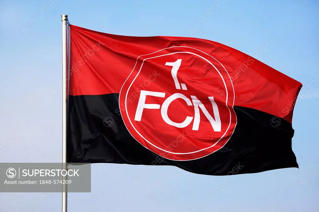 Waving flag of the 1. FC Nuremberg football club against a blue sky, Upper Franconia, Bavaria, Germany, Europe