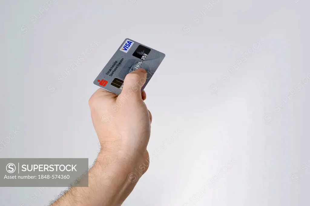 Hand holding bank card, debit card