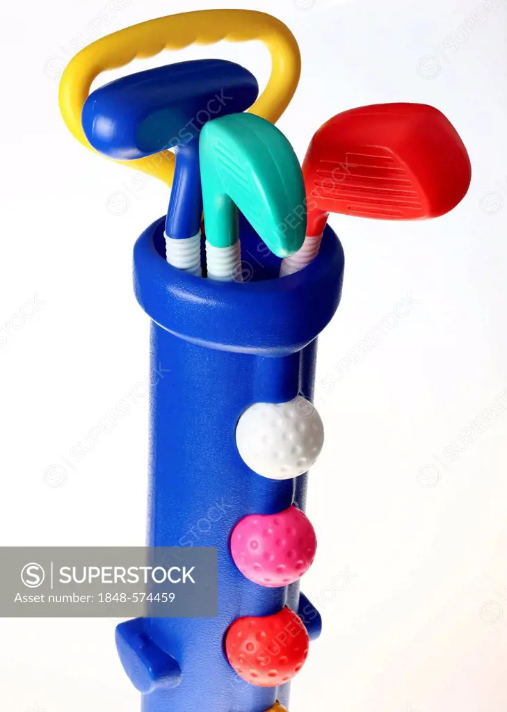 Toy plastic golf equipment, golf clubs and golf balls in a golf bag