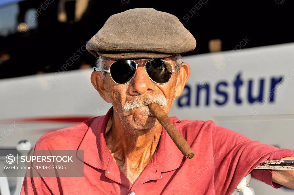 Cuban man smoking a cigar, Vinales, Valle de Vinales, Pinar del Rio province, Cuba, Greater Antilles, Central America, America