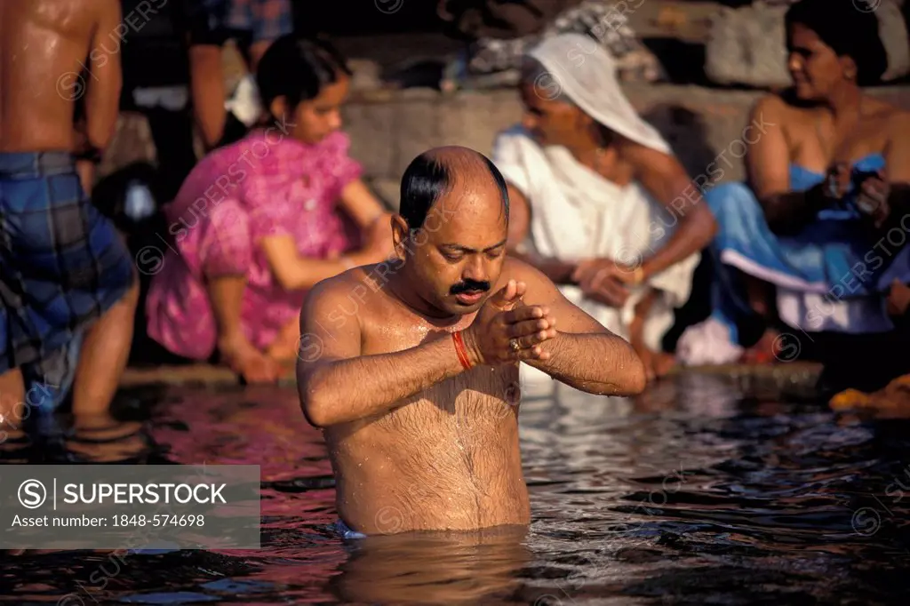 Hindu during his Puja morning prayer, Ganges River, Varanasi also known as Benaras, Uttar Pradesh, India, Asia