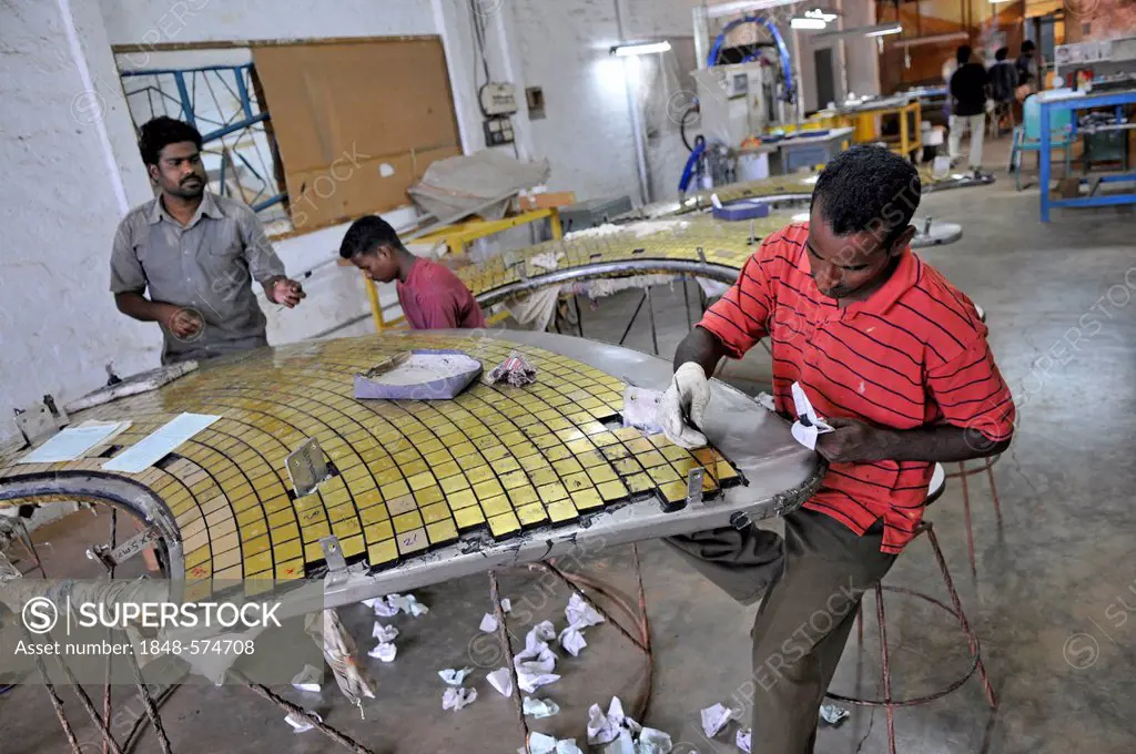 Indian laborers working on the facade of the Matrimandir building, Auroville, near Pondicherry, Tamil Nadu, India, Asia