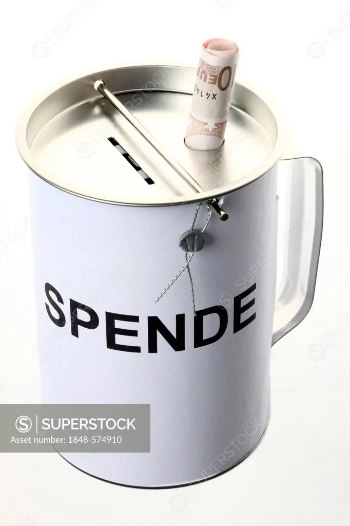 Donation box labeled Spende, German for donation, with slots for coins and bills, with a security seal to protect against unlawful opening
