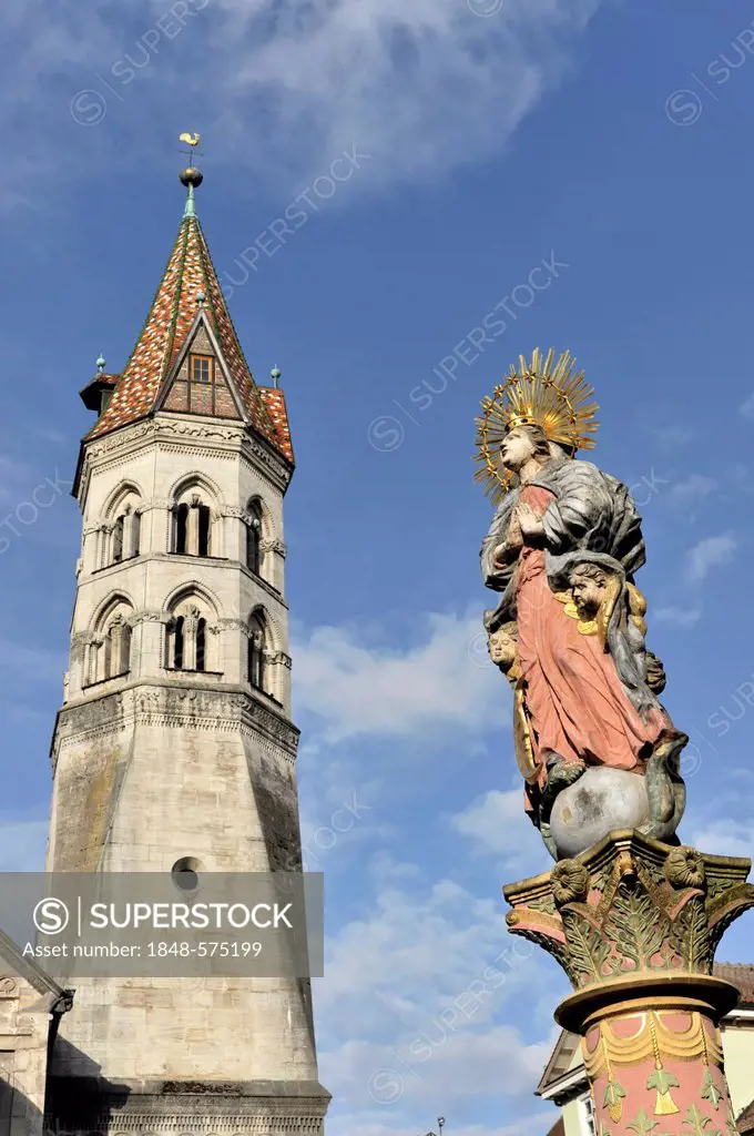 Holy figure on the market well in front of St. John's Church, with St. John's bell tower, late Romanesque, built from 1210-1230, Schwaebisch Gmuend, B...