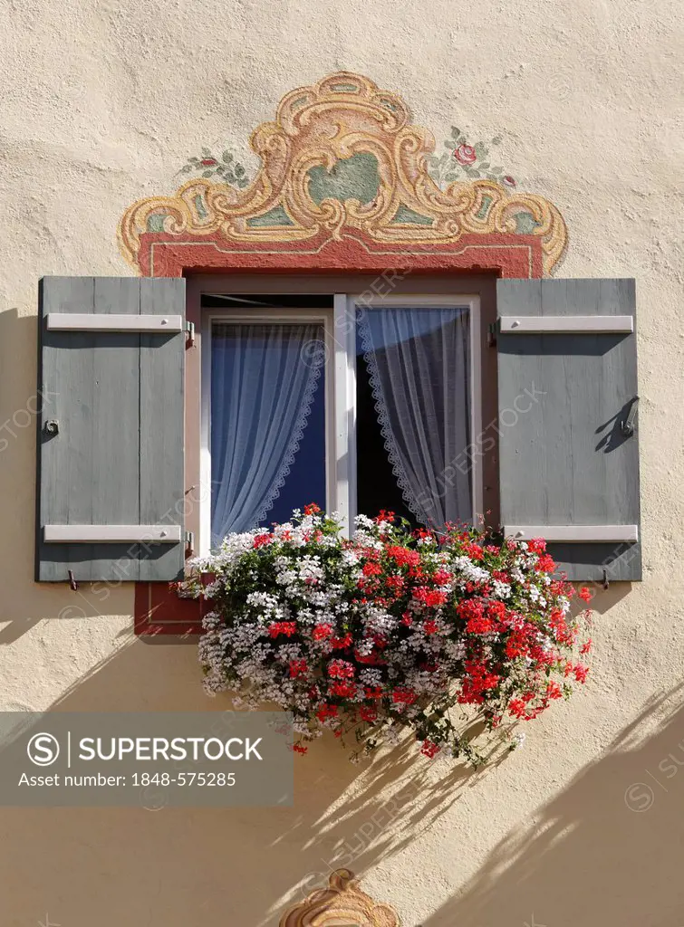 Window with Lueftlmalerei, frescoes on facade, and geraniums, Neubeuern, Inn Valley, Chiemgau region, Upper Bavaria, Bavaria, Germany, Europe