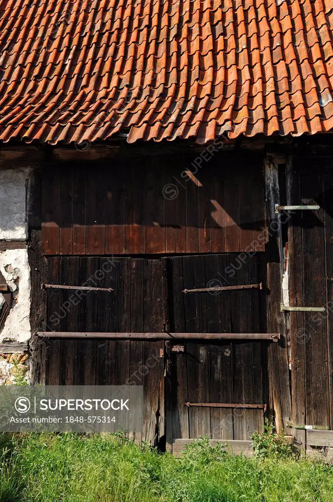 Old wooden barn gate on a farm, Koenigsberg, Lower Franconia, Bavaria, Germany, Europe