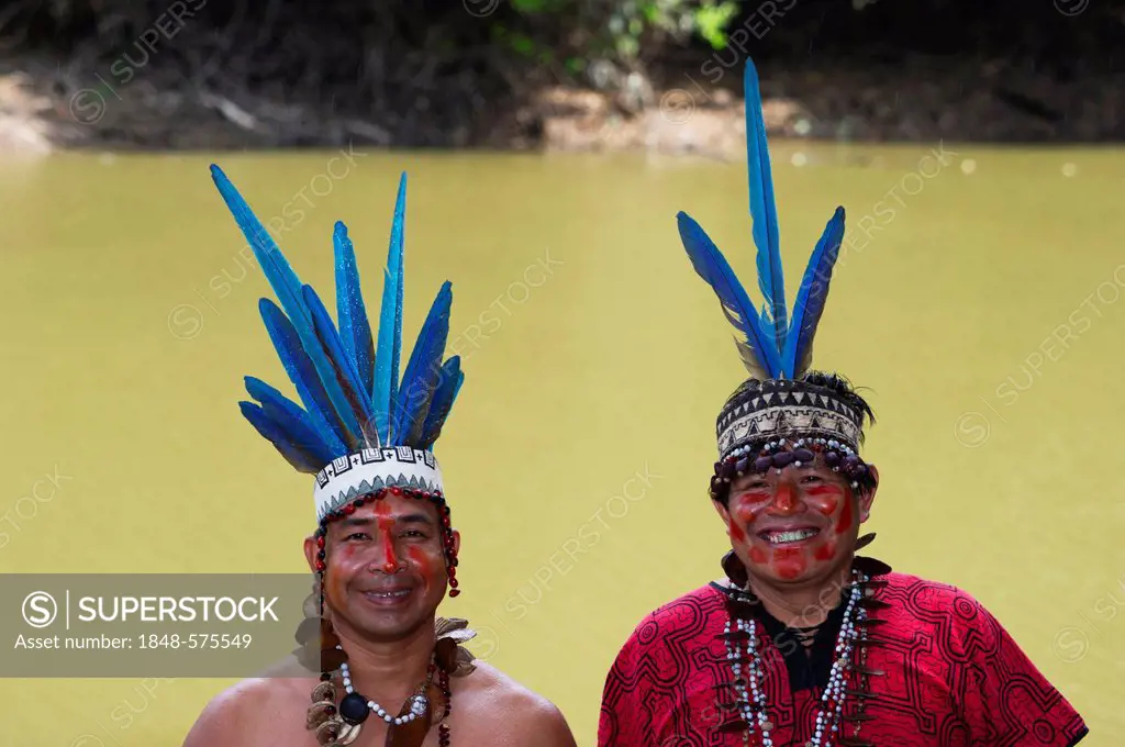Guillermo Rodriguez Gomez, shaman of the Bora tribe, left, wearing macaw feather headdress worn during shamanic ceremonies, with assistant, northern A...