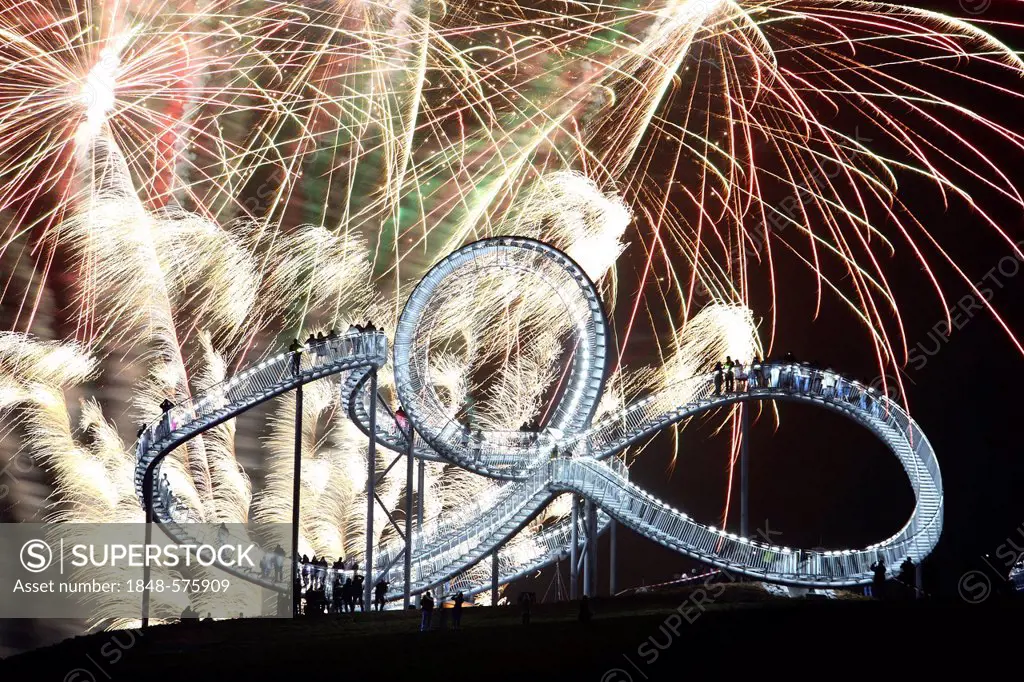 Fireworks display during opening of the walkable landmark sculpture in the shape of a roller coaster, Tiger & Turtle - Magic Mountain by Heike Mutter ...
