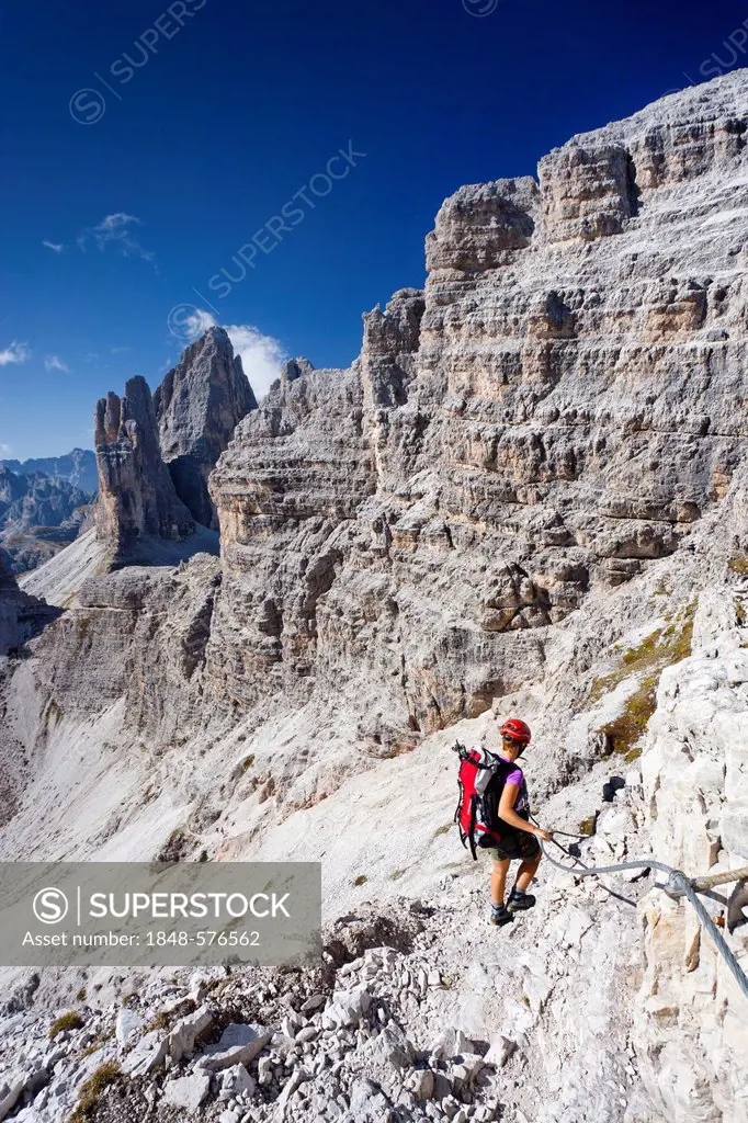 Climbers ascending Mt Paternkofel or Paterno, Tre Cime di Lavaredo massif in the back, Hochpustertal valley or Alta Pusteria, Sexten, Dolomites, South...