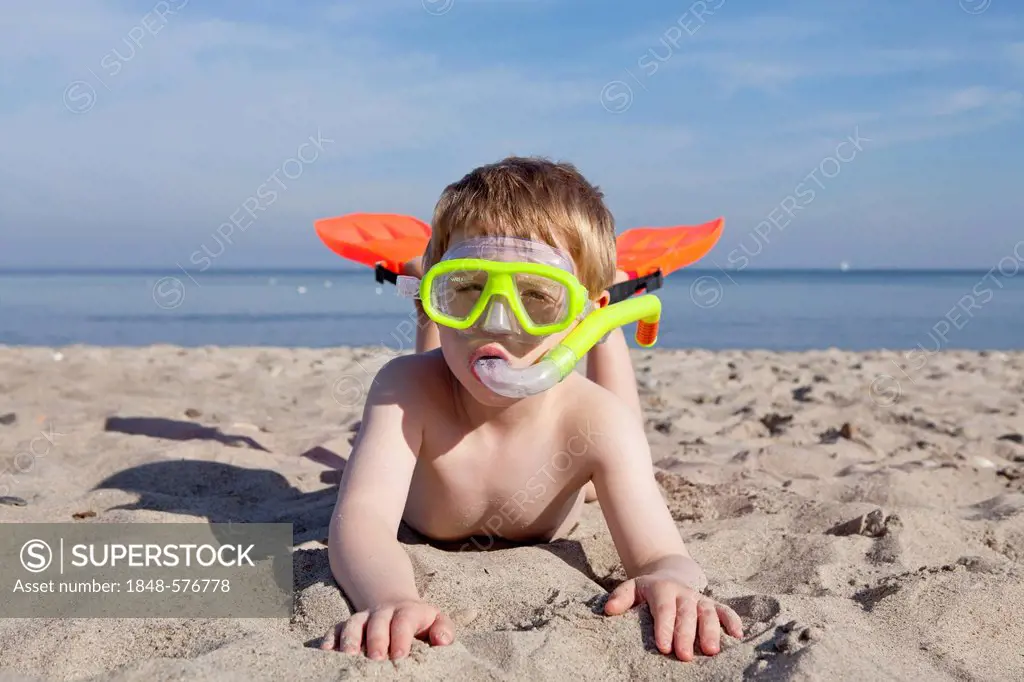 Young boy with diving goggles, snorkel and flippers, beach of Kuehlungsborn, Mecklenburg-Western Pomerania, Germany