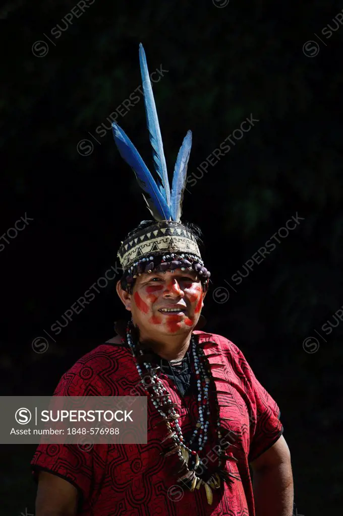 Shaman's assistant from Bora tribe, wearing Macaw feather headdress, northern Amazon Basin, Peru, South America