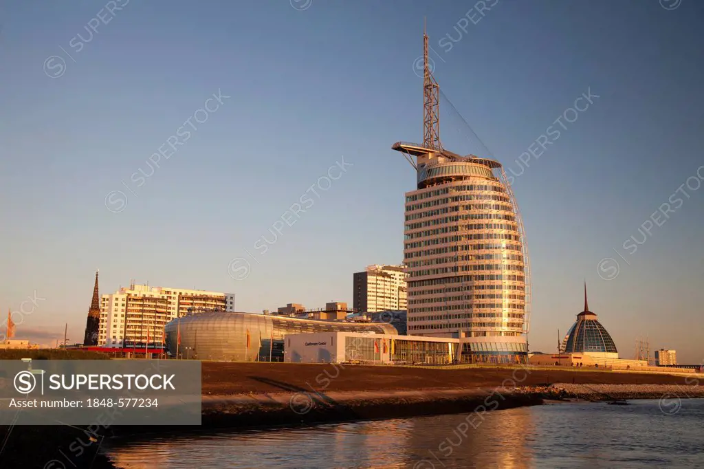 Modern architecture on the banks of the Weser River in the evening light, Klimahaus building, Conference Center, Sail City, Havenwelten, Bremerhaven, ...