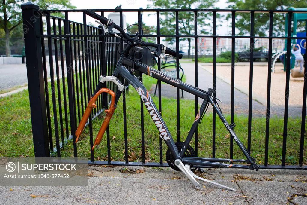 Remains of a bicycle, chained to a fence, Boston, Massachusetts, New England, USA