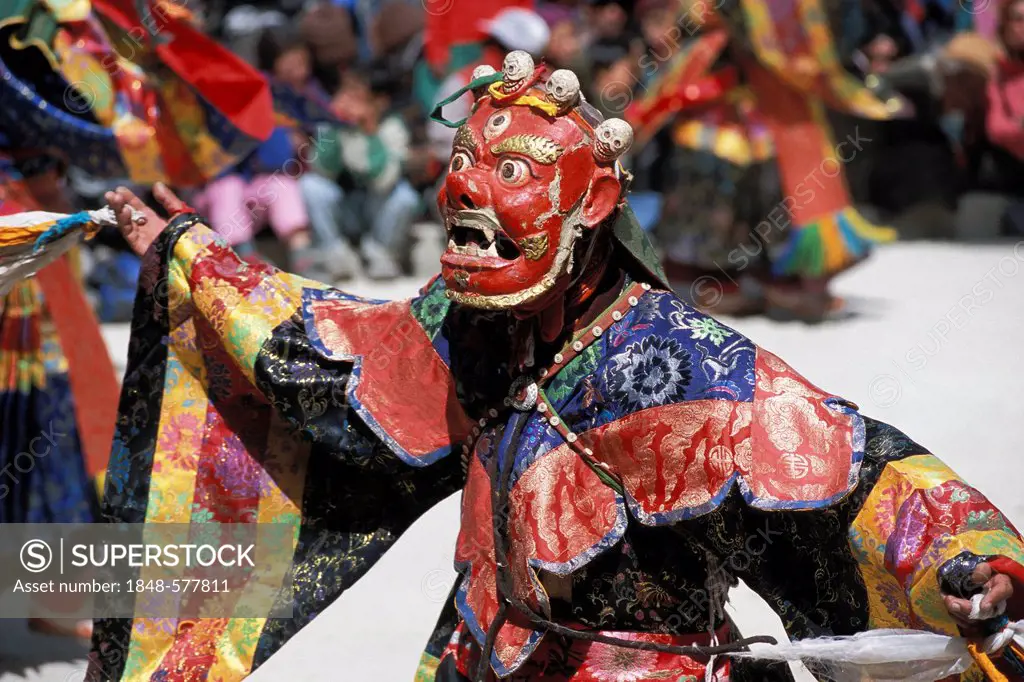 Cham dancer wearing a red mask, Tibetan mask dance, Tibetan festival of a monastery, Sani, near Padum, Zanskar, Ladakh, Indian Himalayas, Jammu and Ka...