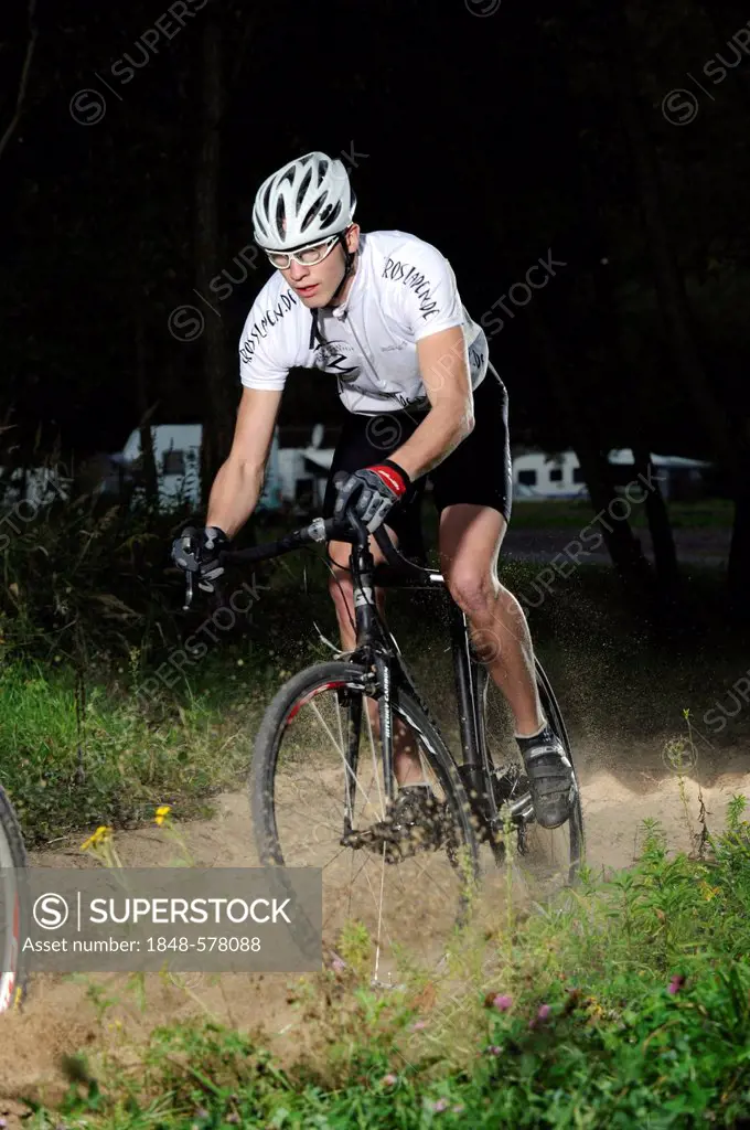 Bicyclist, cross-rider on the track in Cochem, Rhineland-Palatinate, Germany, Europe
