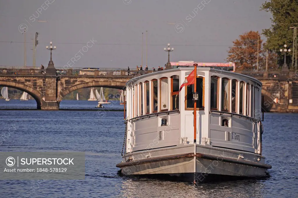 Boat on the Alster River, Lombardsbruecke bridge at the back, Hamburg, Germany, Europe