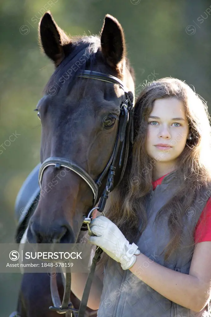 Girl, 17 years, with her horse