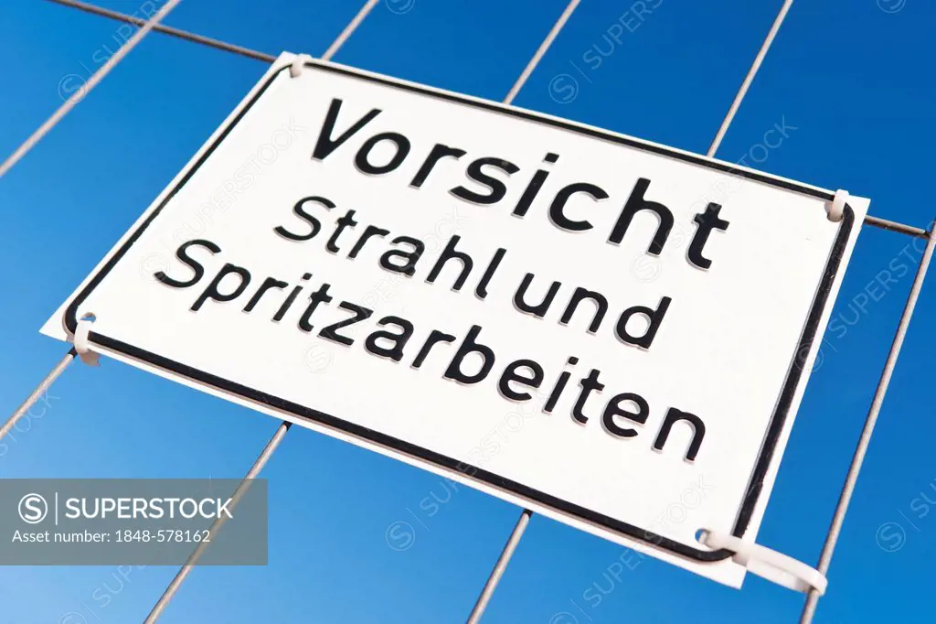 Sign Vorsicht Strahl- und Spritzarbeiten, German for blasting and spraying works