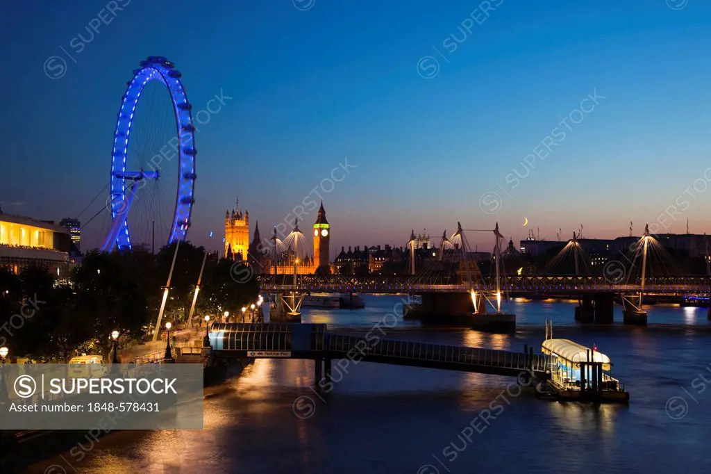 View of the River Thames with the Royal Festival Hall, the London Eye and the Houses of Parliament with Big Ben at dusk, London, England, United Kingd...