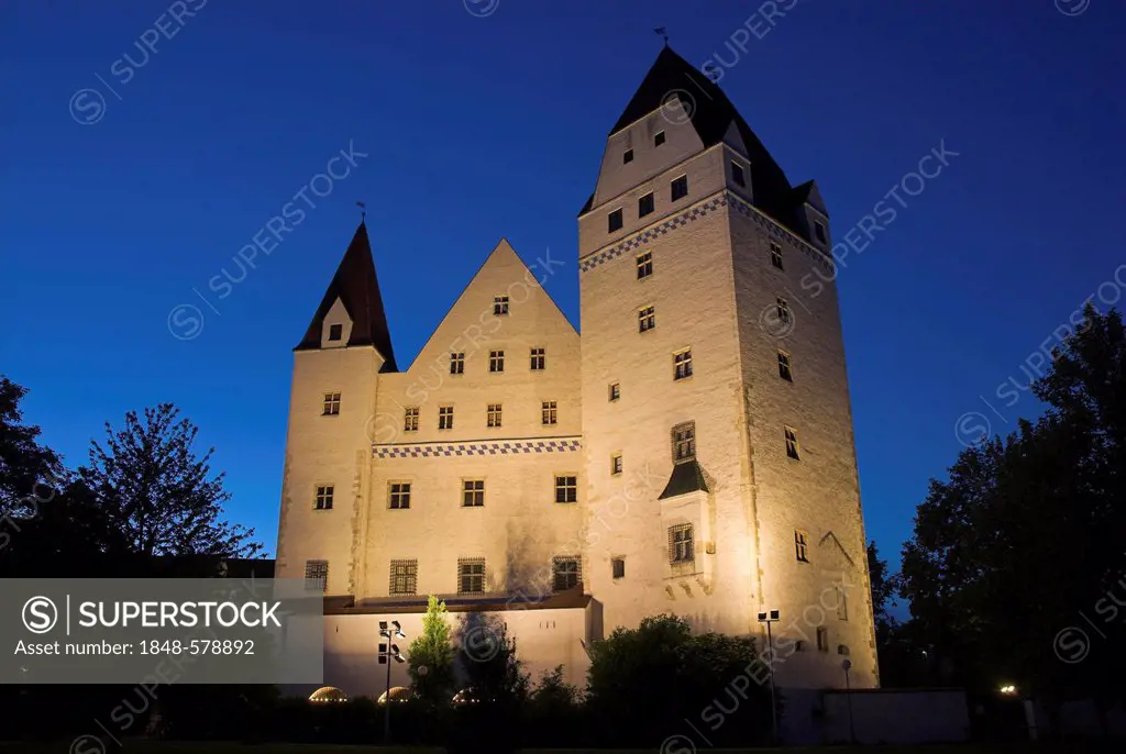 The New Castle in Ingolstadt illuminated by floodlight at the blue hour in the evening, Bavaria, Germany, Europe
