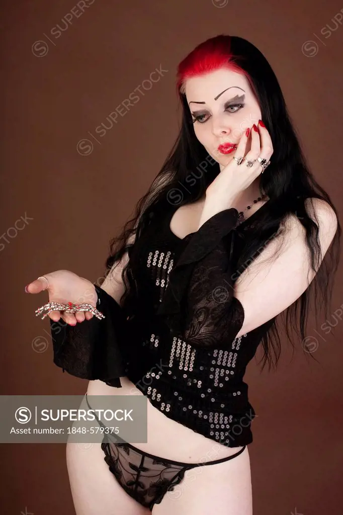 Woman, Gothic, holding a spider, slip