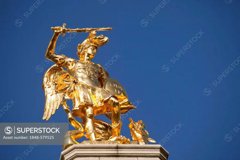 A gilded statue of the Archangel Michael with the dragon on the Koblenzer Tor gate in Bonn, North Rhine-Westphalia, Germany, Europe