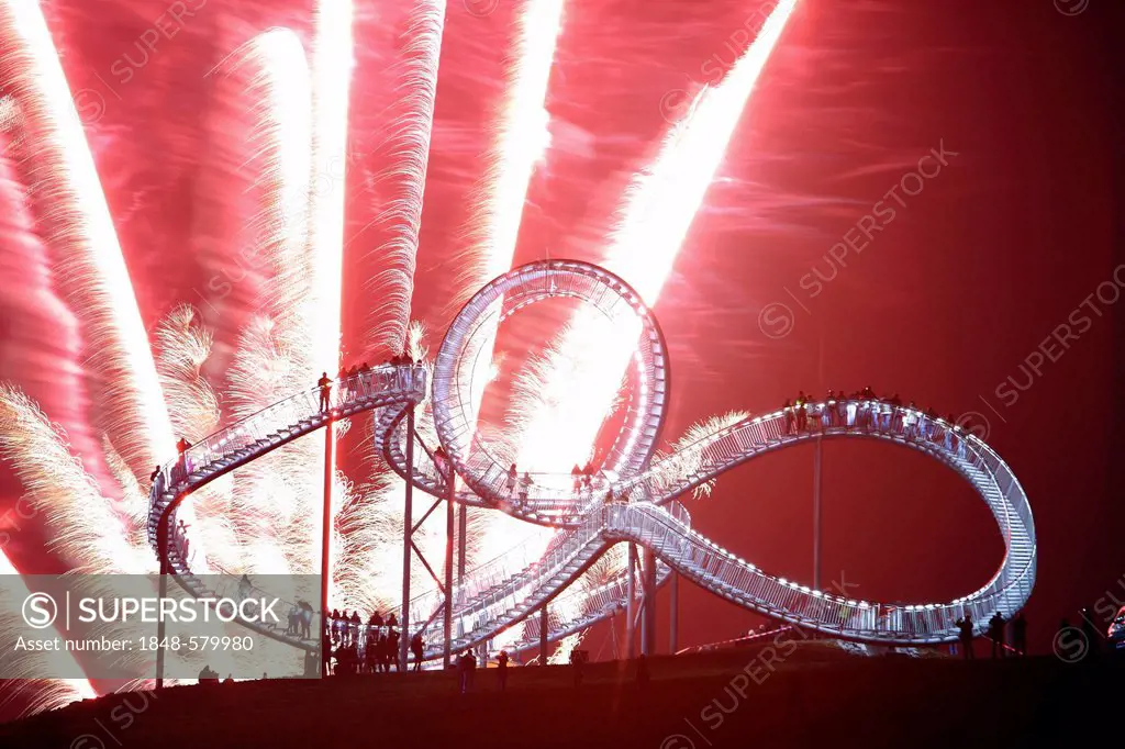 Fireworks display during opening of the walkable landmark sculpture in the shape of a roller coaster, Tiger & Turtle - Magic Mountain by Heike Mutter ...