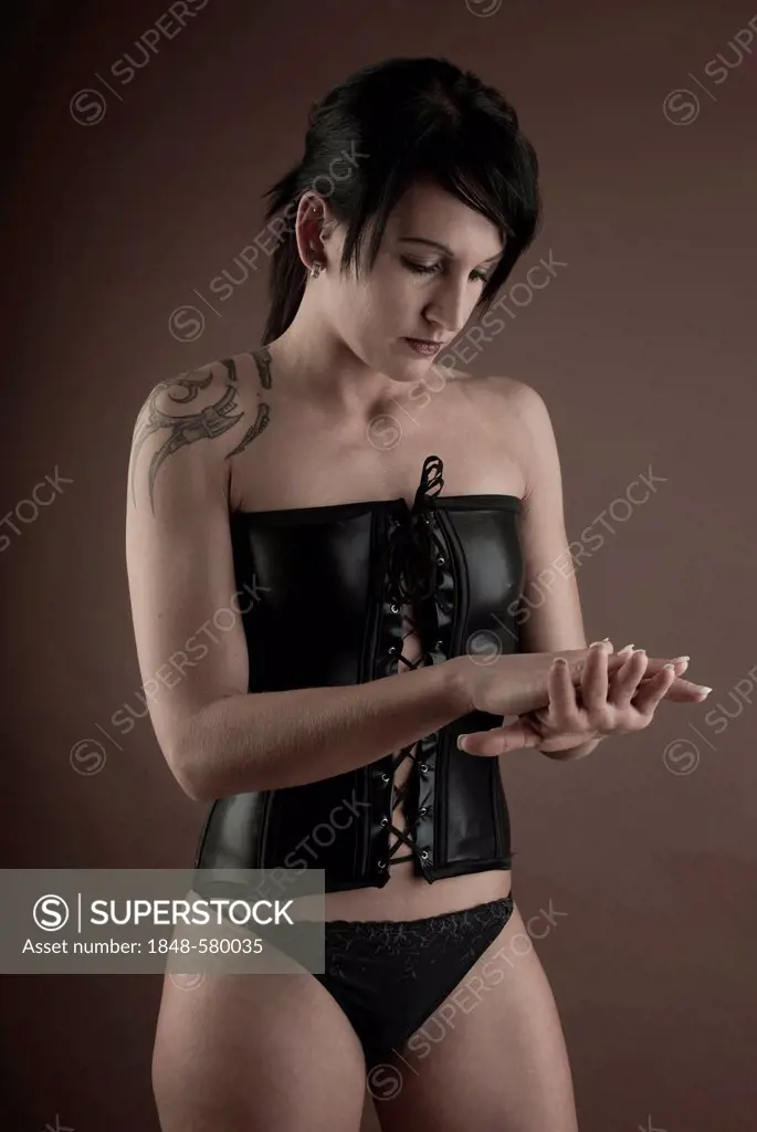 Woman, Gothic, tattoo, latex underwear, standing