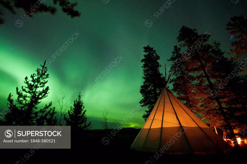 Illuminated Tipi, Northern lights, Polar Aurorae, Aurora Borealis, green, near Whitehorse, Yukon Territory, Canada