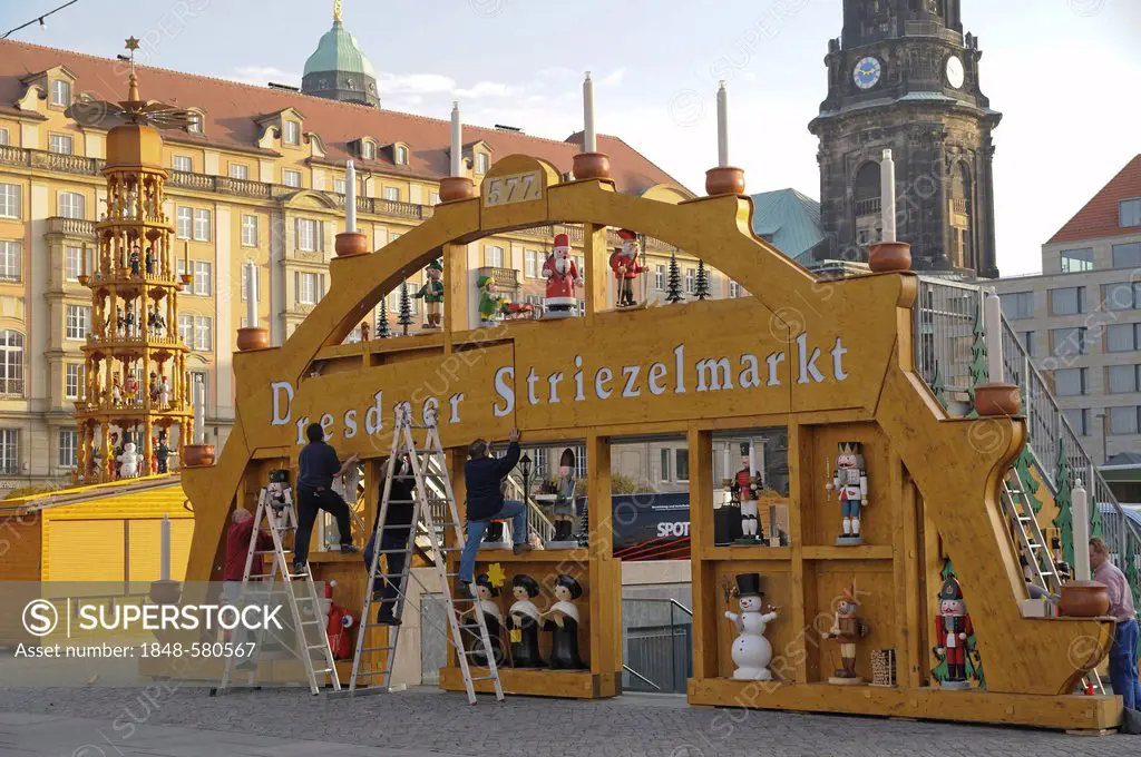 Striezelmarkt Christmas market and Schwibbogen candle arch are being set up, Altmarkt square in Dresden, Saxony, Germany, Europe