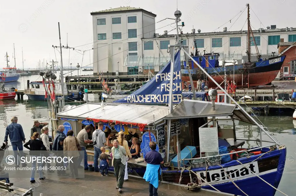 Selling fish on a boat in Sassnitz Harbour, Ruegen, Mecklenburg-Western Pomerania, Germany, Europe