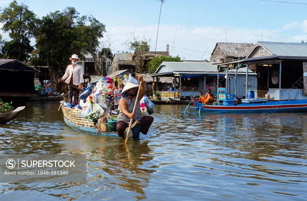 Boat transporting goods across the Tonle Sap River, Kampong Chhnang, Cambodia, Southeast Asia