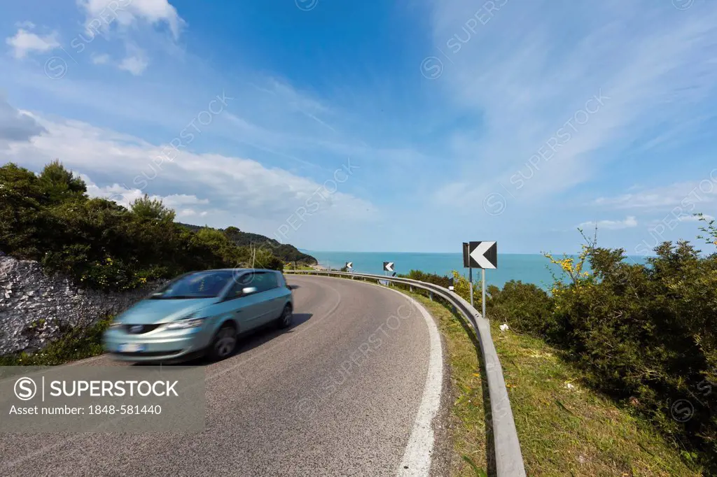 Road near Vico del Gargano with a passing car, Foggia Province, Puglia, Apulia, Gargano, Adriatic Sea, Italy, Europe