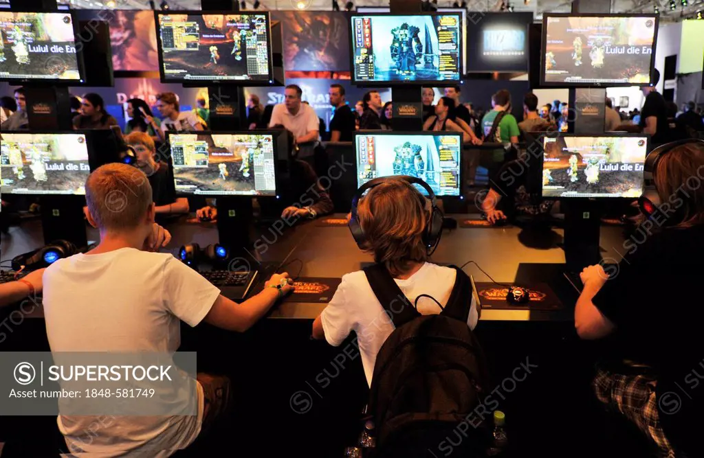 Young people playing the computer game Warcraft at the Gamescom Computer Game Fair, Cologne, North Rhine-Westphalia, Germany, Europe