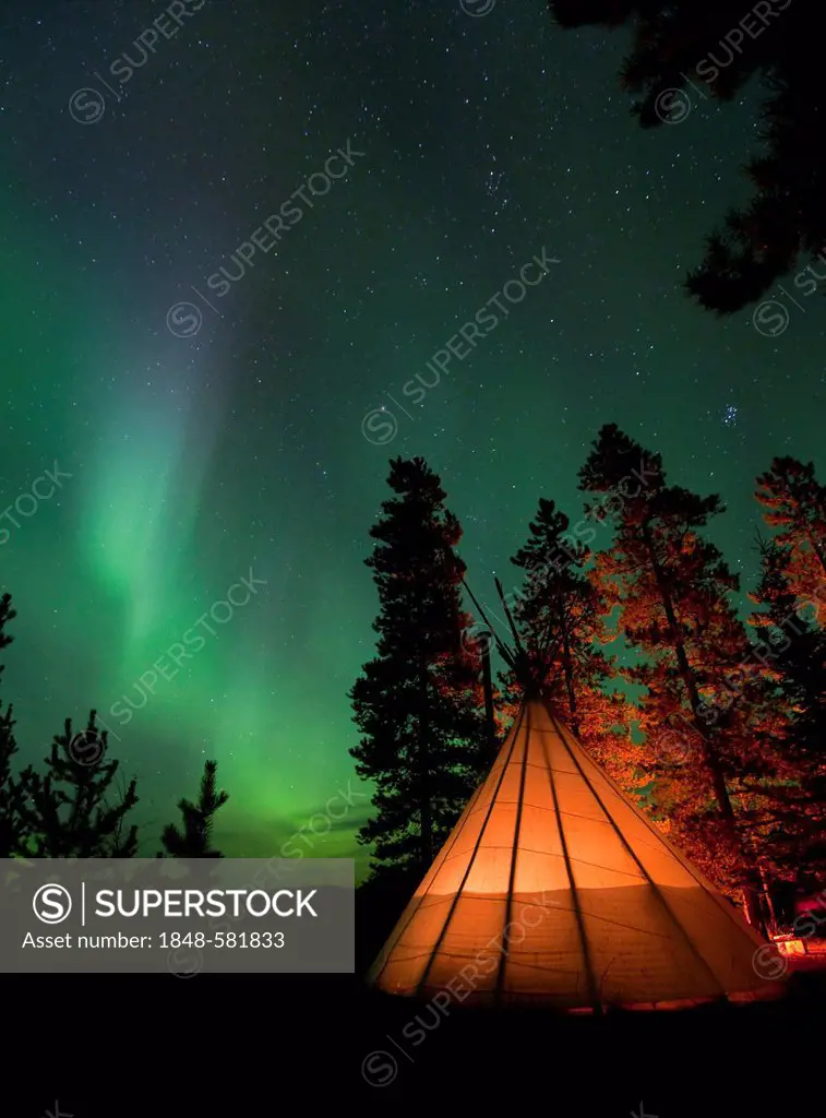 Illuminated Tipi, Northern lights, Polar Aurorae, Aurora Borealis, green, near Whitehorse, Yukon Territory, Canada